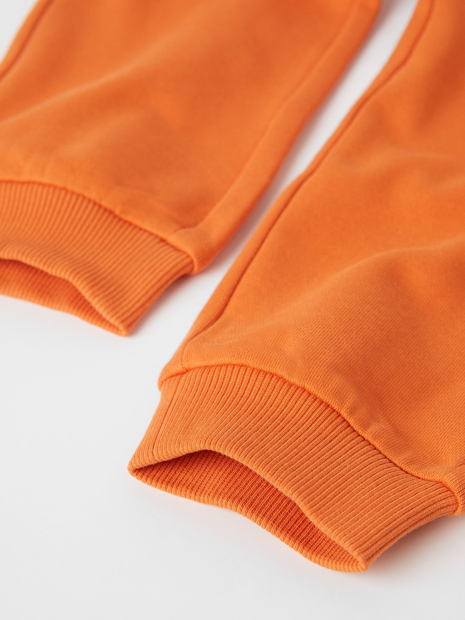 Organic Cotton Orange Kids Joggers from the Polarn O. Pyret kidswear collection. Made using 100% GOTS Organic Cotton