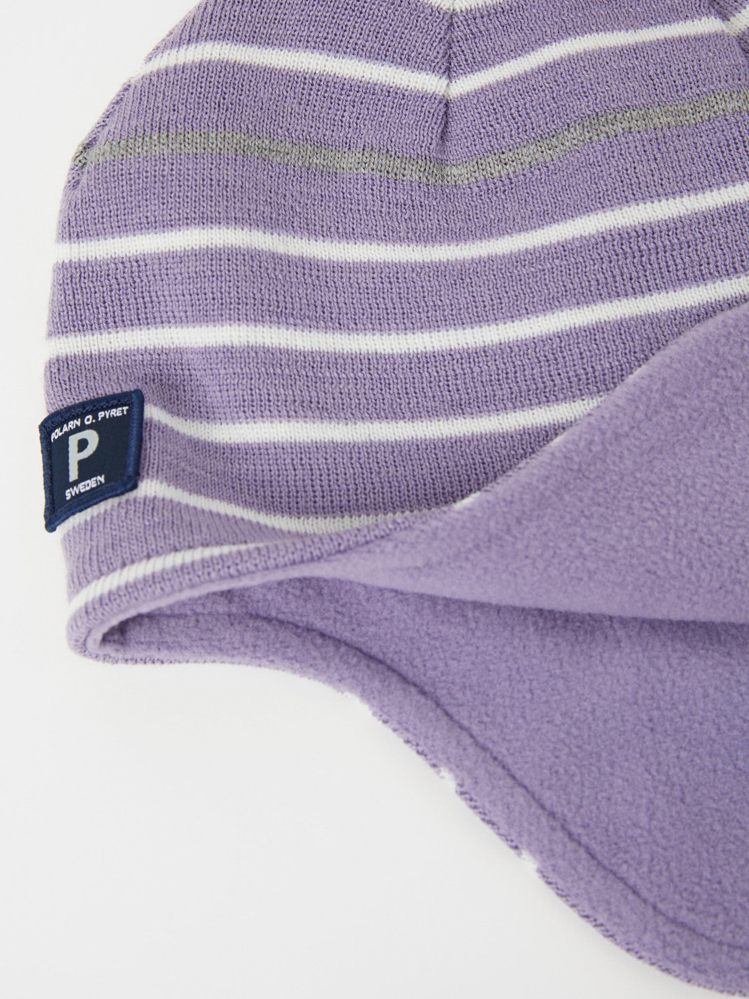 Merino Wool Purple Kids Bobble Hat from the Polarn O. Pyret outerwear collection. Ethically produced kids outerwear.