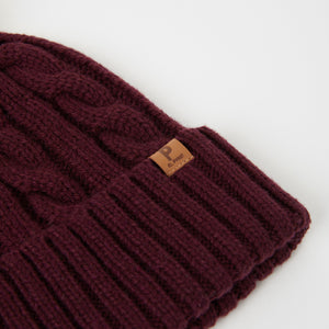 Burgundy Kids Wool Bobble Hat from the Polarn O. Pyret outerwear collection. The best ethical kids outerwear.