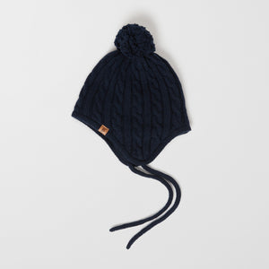 Wool Kids Navy Bobble Hat from the Polarn O. Pyret outerwear collection. Made using ethically sourced materials.