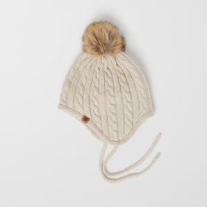 Wool Kids Beige Bobble Hat from the Polarn O. Pyret outerwear collection. Ethically produced kids outerwear.