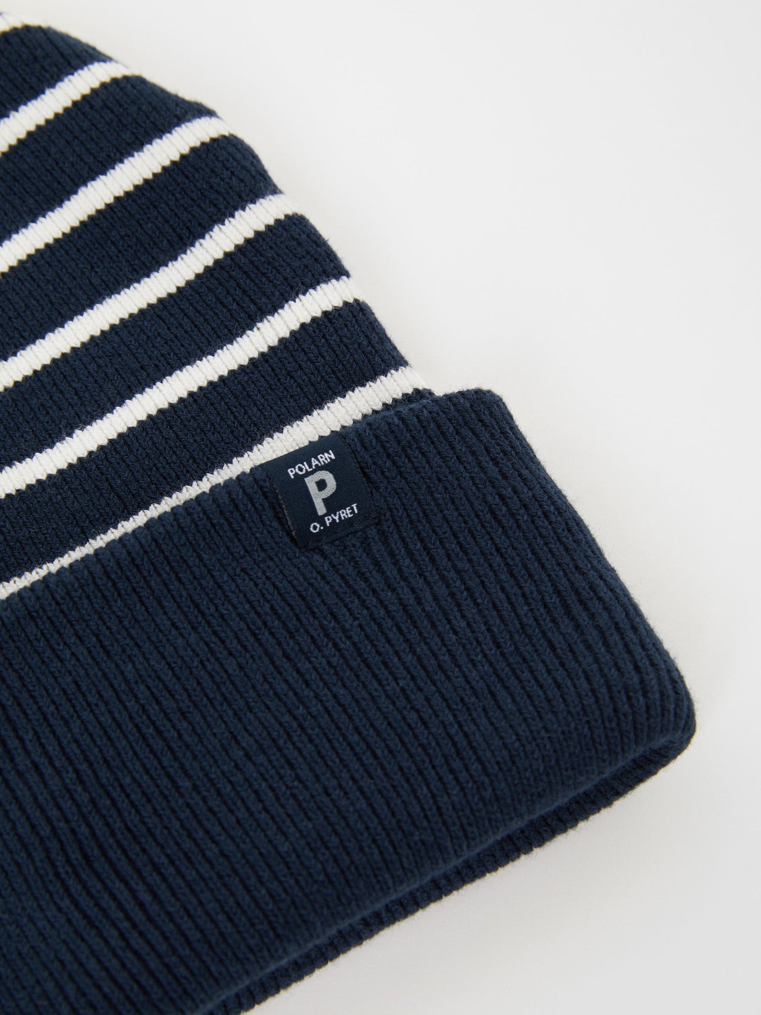 Ribbed Navy Kids Beanie Hat from the Polarn O. Pyret outerwear collection. Made using ethically sourced materials.