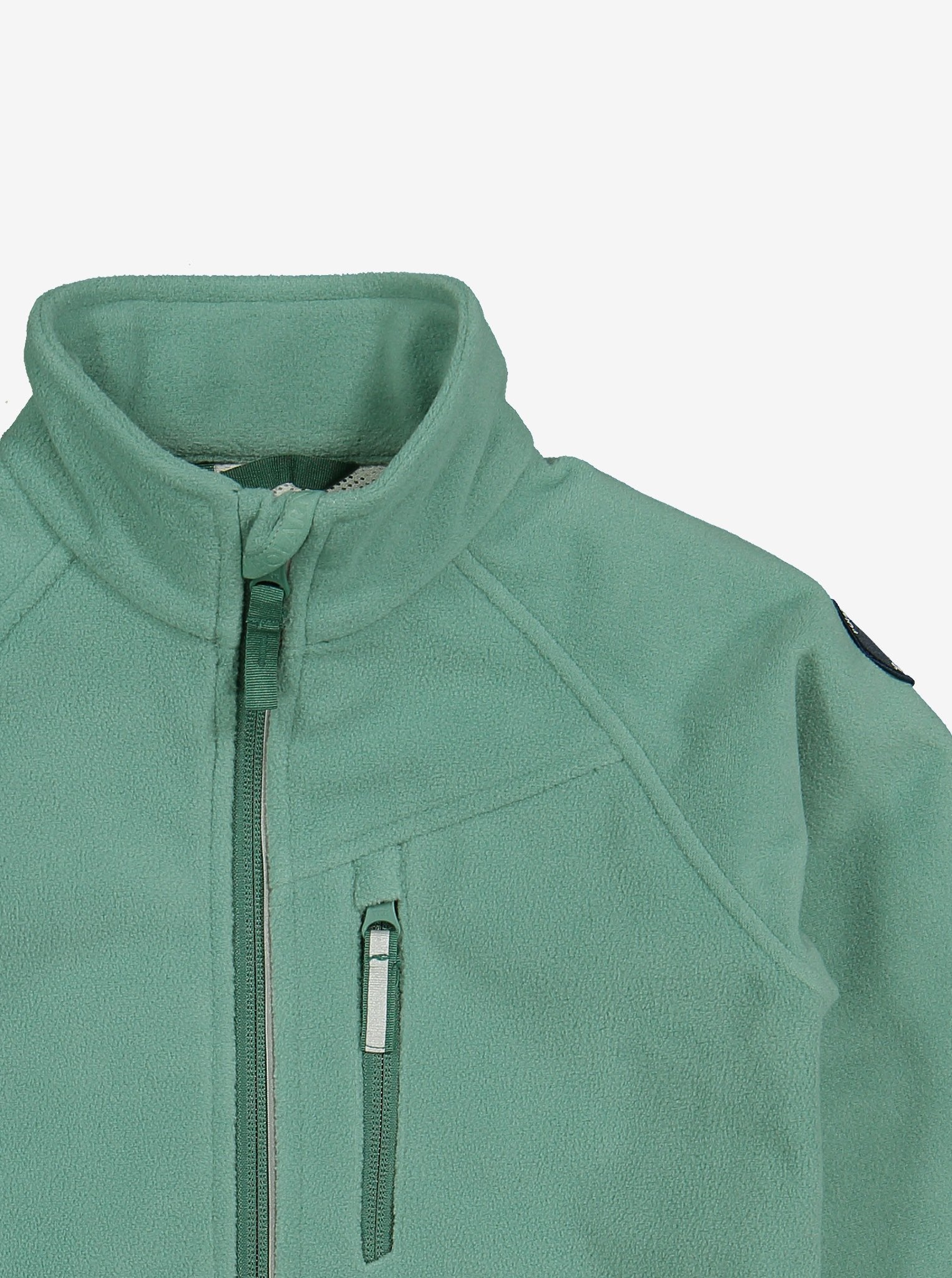 Close up shot of green, kids waterproof fleece jacket made of soft and flexible fabric, comes with reflector on zips and a front pocket.