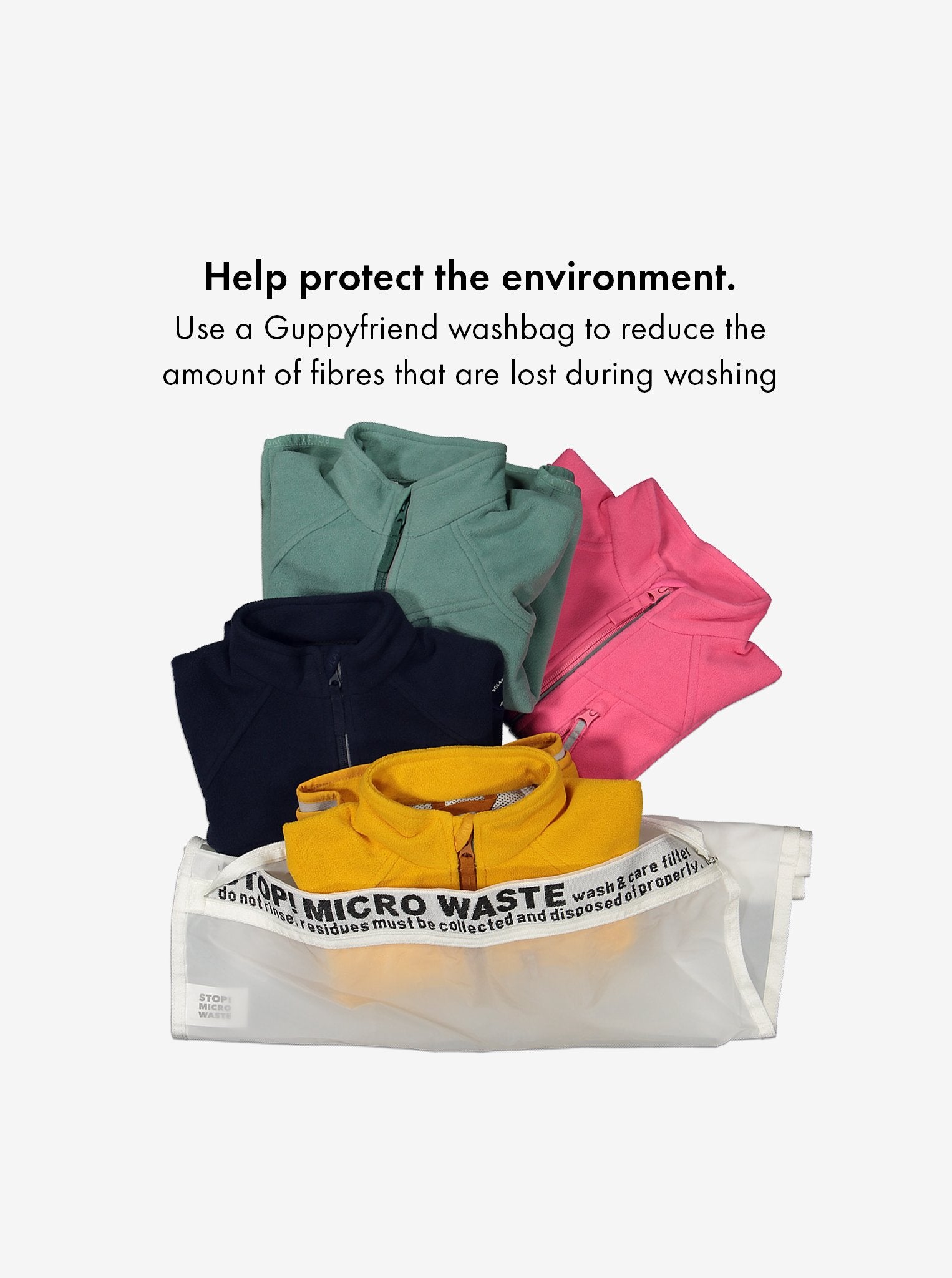 Waterproof, kids fleece jacket in green, pink, navy, and yellow place in an eco-friendly, Guppyfriend washbag.