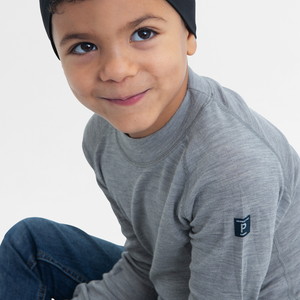 boy wearing kids merino wool top grey, warm and comfortable, ethical and long lasting polarn o. pyret