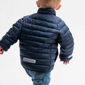 boy wearing navy water resistant kids puffer jacket, recycled materials, warm and comfortable, ethical long lasting polarn o. pyret