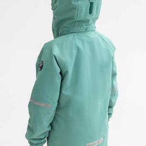 Back view of a boy wearing a green, kids waterproof jacket made of lightweight fabric, with silver reflectors on the sleeves.